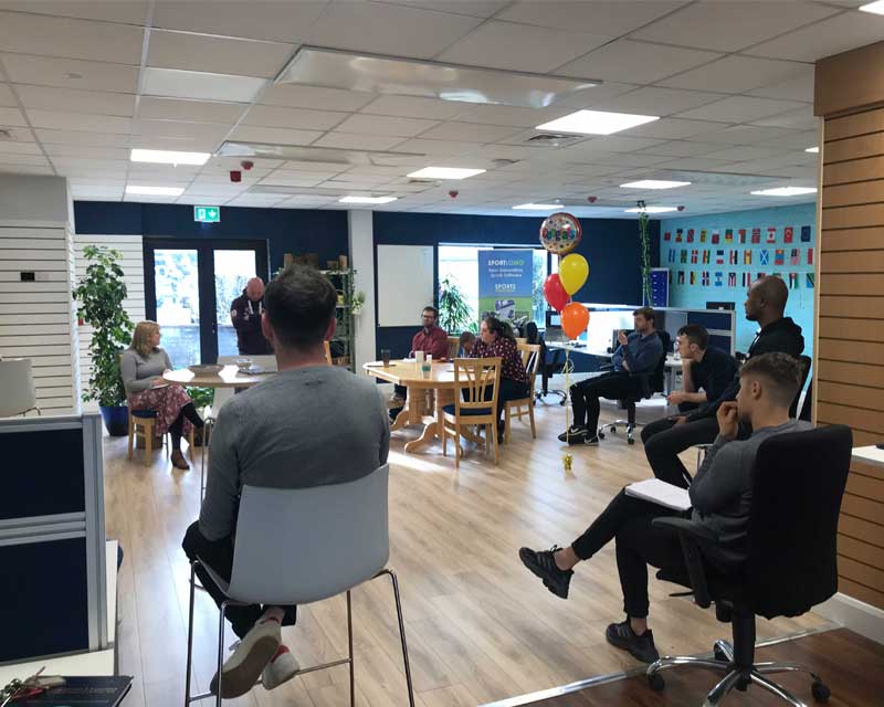 SportLoMo team members working together in modern office environment