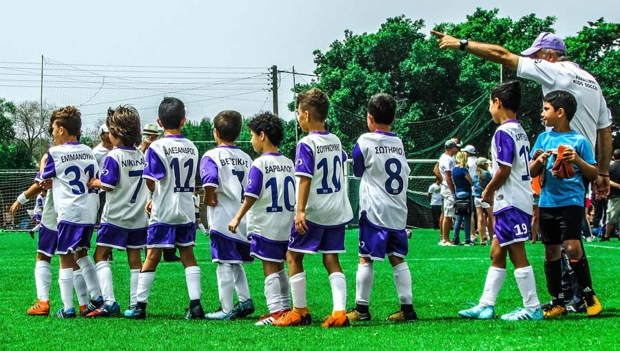 youth soccer team with coach